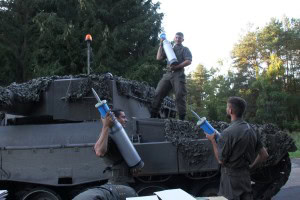 Armored Battalion 14 Crew members ammunitioning a tank