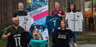 Soldiers with a heart hand over donation to JUNO