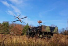 German Armed Forces test reconnaissance and strike network of drones Loitering ammunition shortly before hitting a target vehicle - ©GUZ Stark